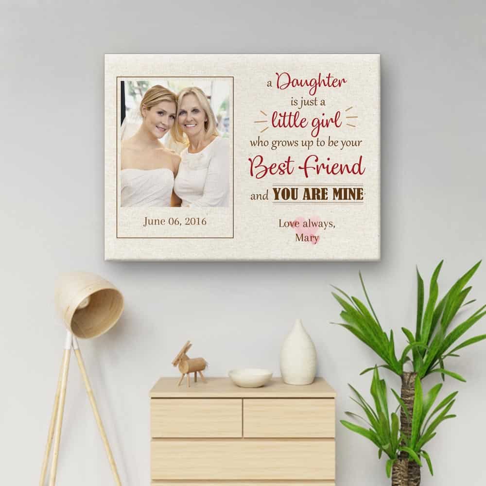 A Daughter Is Just A Little Girl Photo Canvas Print hanging above a cabinet