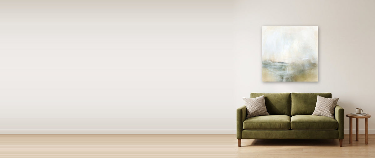 Living room with a large abstract canvas above a green sofa