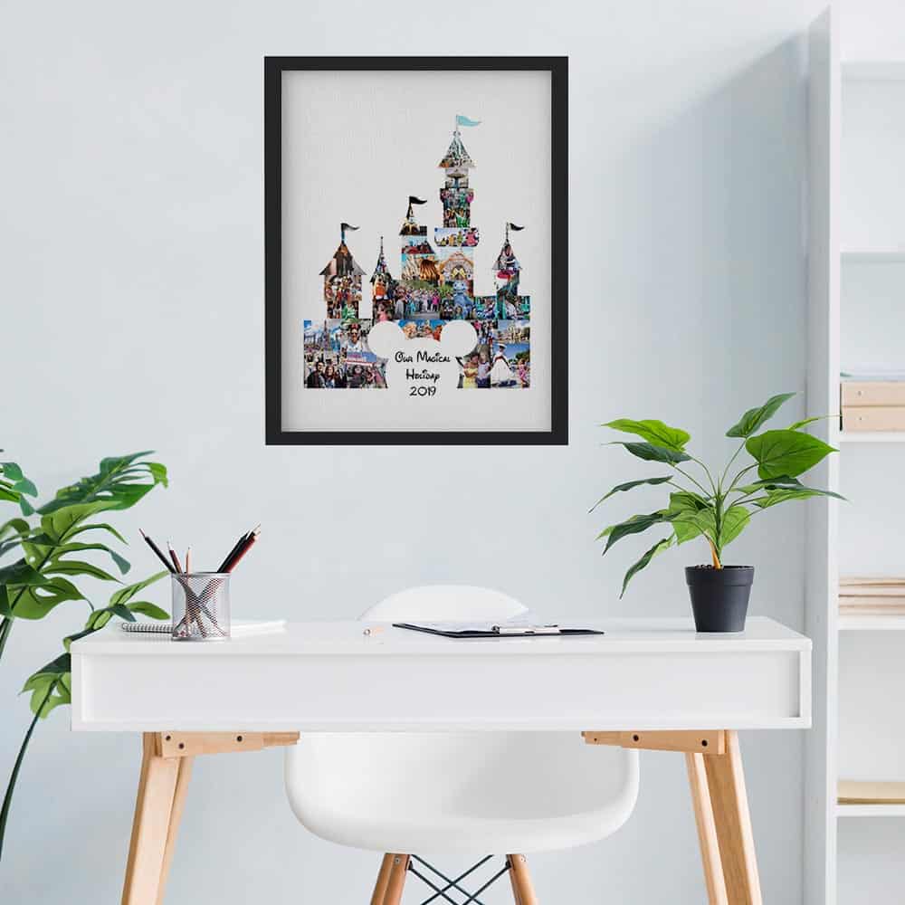 Our Magical Holiday Photo Collage Canvas Print with black frame above a desk