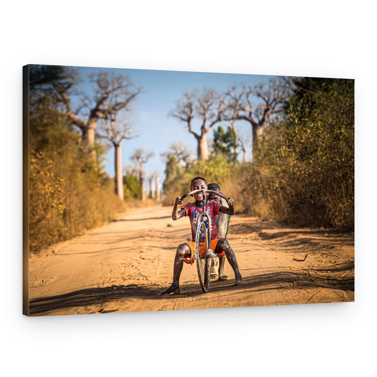 African Boy's Playful Ride – Canvas Print