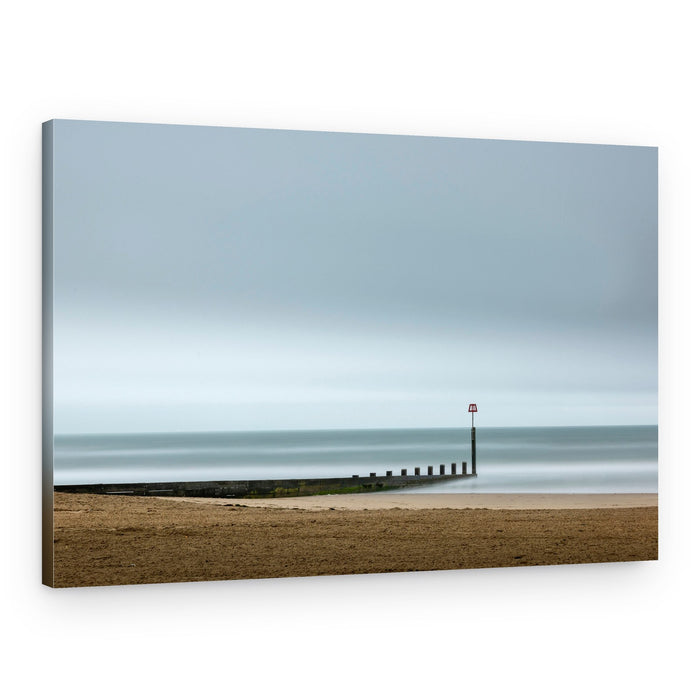 Tranquil Beach Groyne – Canvas Print